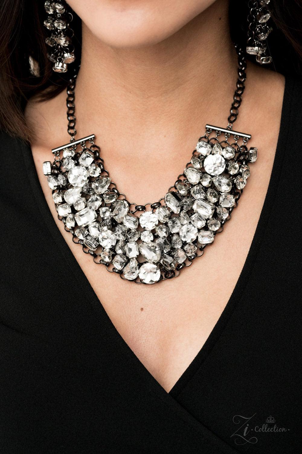 Paparazzi Accessories Ambitious 💗💗ZiCollection $25💗💗 A modern mashup of round, teardrop, and emerald cut white rhinestones link into jam-packed rows of jaw-dropping radiance. Attached to an interconnected gunmetal mesh backdrop, the clustered fringe f