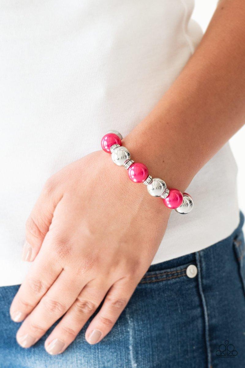 Paparazzi Accessories So Not Sorry - Pink A collection of white rhinestone encrusted rings, pink pearls, and classic silver beads are threaded along a stretchy band around the wrist for a glamorous look. Sold as one individual bracelet. Jewelry