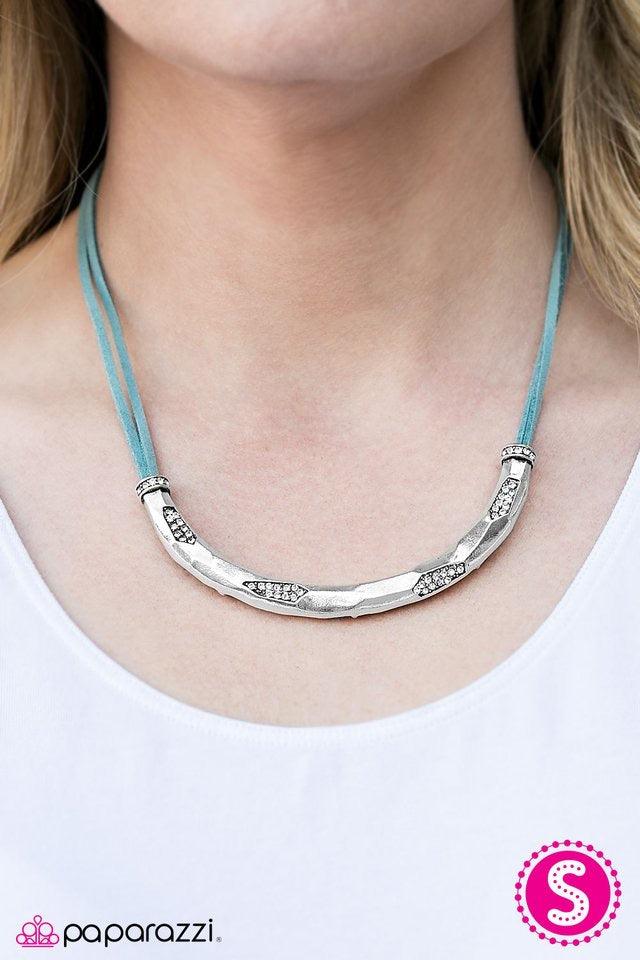 Paparazzi Accessories The Glitter Rush - Blue A hammered silver bar slides along strands of blue suede, dipping just below the collar. Layers of silver are chipped away, revealing hints of sparkling rhinestone accents for a handcrafted finish. Features an