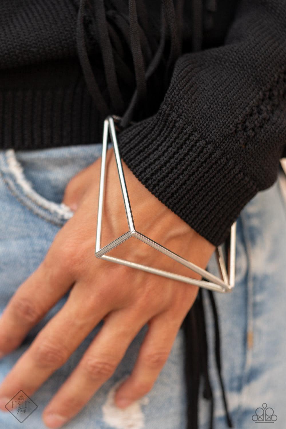 Paparazzi Accessories In Another Dimension - Silver Exaggerated silver triangle frames connect at their edges to create a geometric bangle with three-dimensional drama. Sold as one individual bracelet. Bracelet