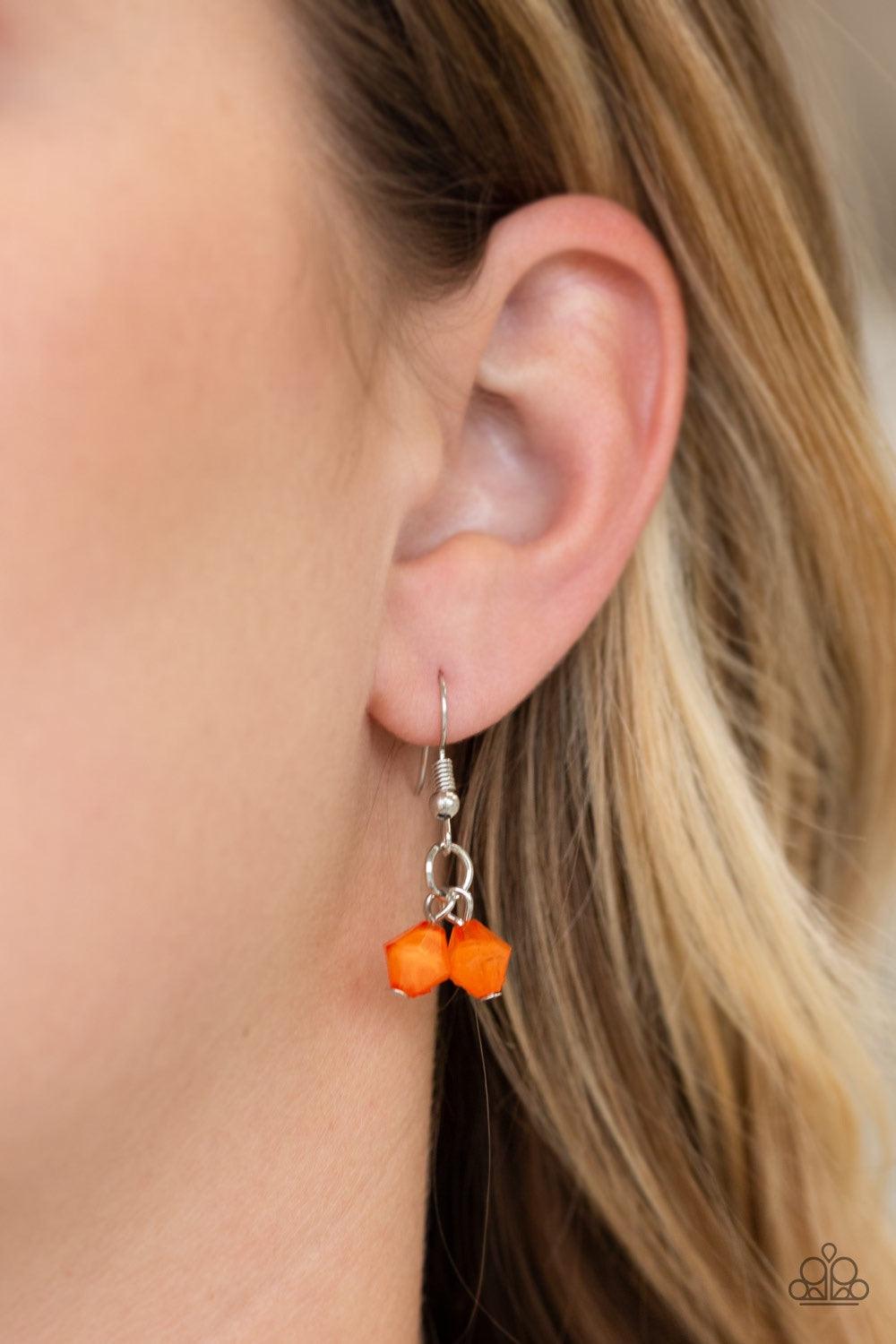 Paparazzi Accessories Grand Canyon Grotto - Orange Featuring polished and cloudy finishes, a collection of Turmeric faux rocks dance from the bottom of a bold silver chain. Classic silver beads trickle between the colorful beading, adding a metallic shimm
