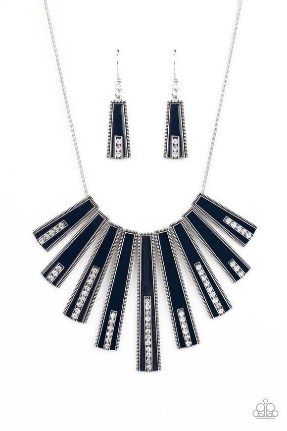 Paparazzi Accessories FAN-tastically Deco - Blue Encased in daintily dotted silver frames, a row of flared silver bars painted in a glossy Navy Blue fans out across the collar. A column of sparkling white rhinestones rises from the bottom of each frame, c