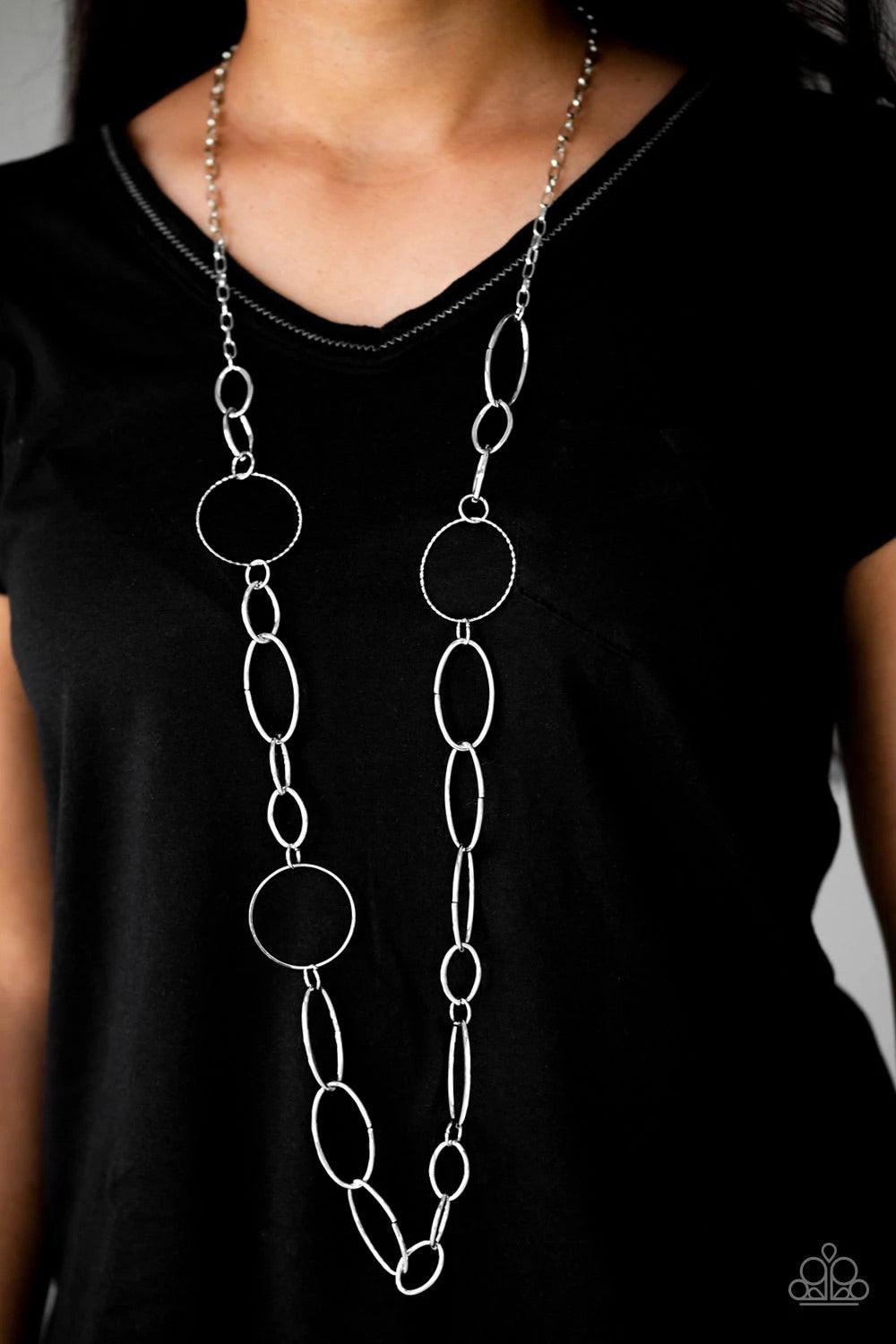 Paparazzi Accessories Perfect Mismatch - Silver An array of smooth and textured silver hoops connect across the chest, creating a bold mismatched palette. Features an adjustable clasp closure. Sold as one individual necklace. Includes one pair of matching