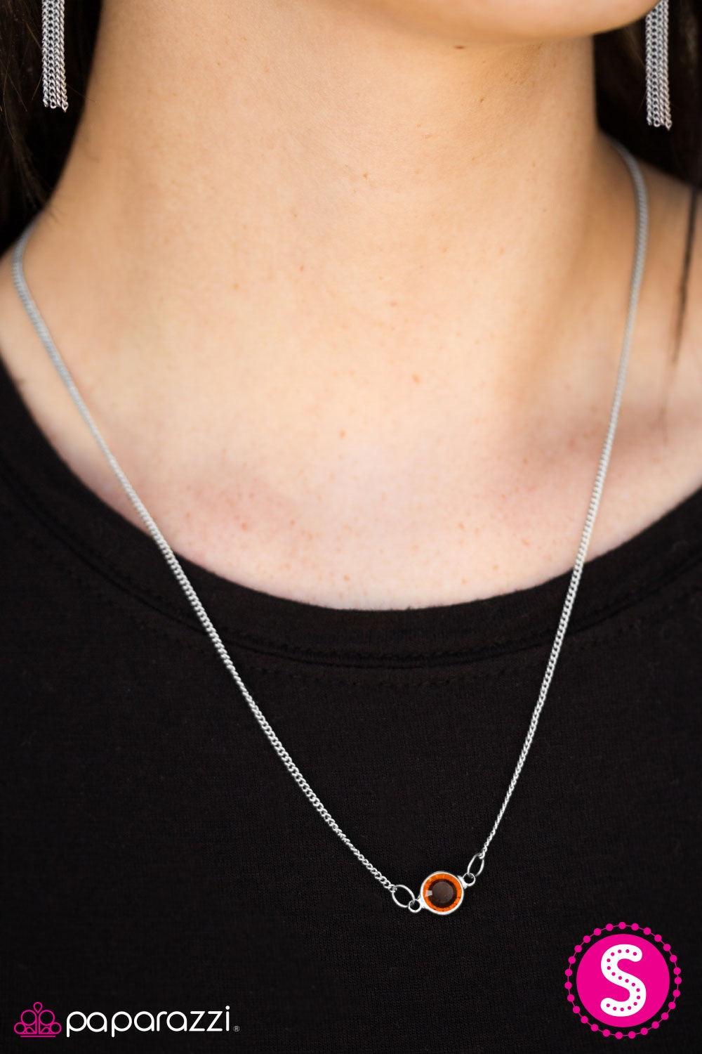 Paparazzi Accessories Stay Glassy -Brown A sparkling brown gem is nestled inside a classic silver frame, creating a simple, yet colorful pendant. Features an adjustable clasp closure. Necklaces