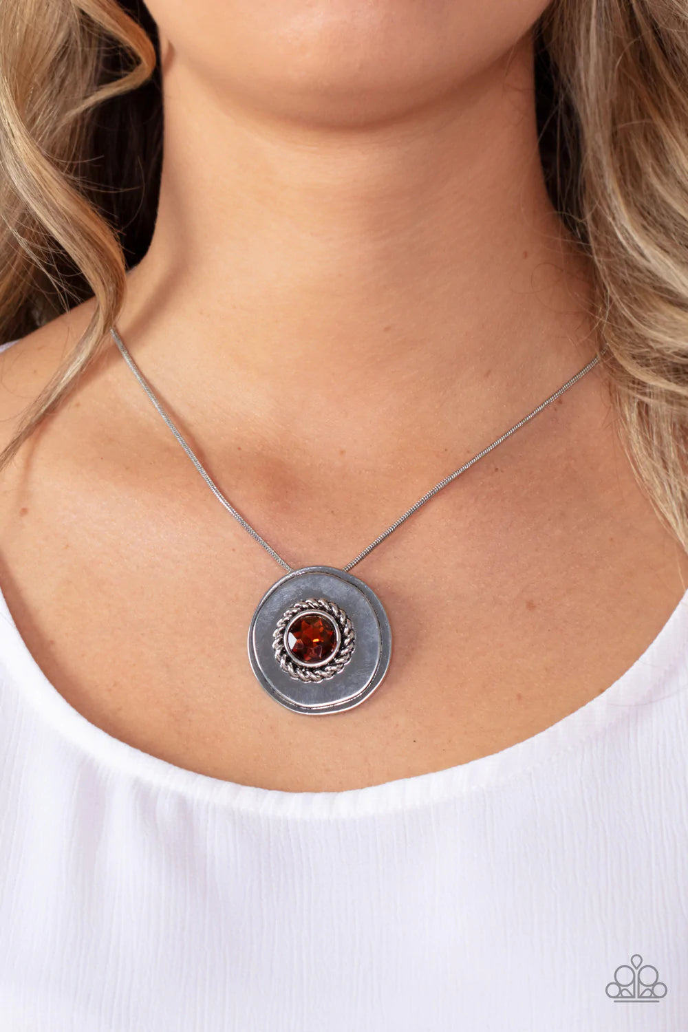 Paparazzi Accessories Make Me MEDALLION-aire - Brown An oversized topaz rhinestone adorns the textured center of an asymmetrical silver disc, creating an edgy medallion at the bottom of a rounded silver snake chain below the collar. Features an adjustable