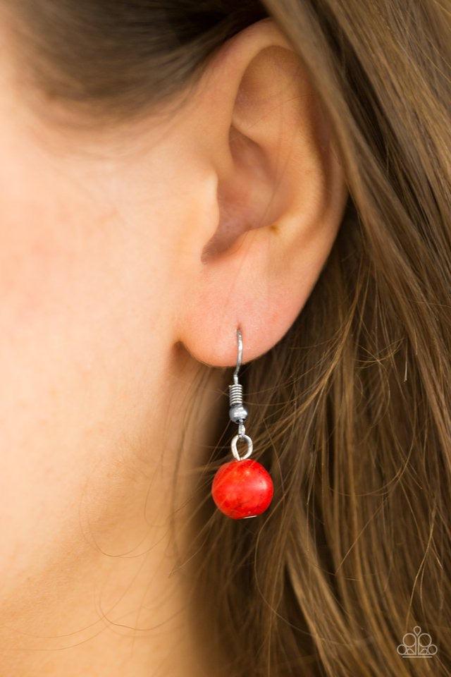 Paparazzi Accessories Simple Stonework - Red Fiery red stones and classic silver beads join airy silver hoops along a silver chain for a seasonal look. Features an adjustable clasp closure. Sold as one individual necklace. Includes one pair of matching ea