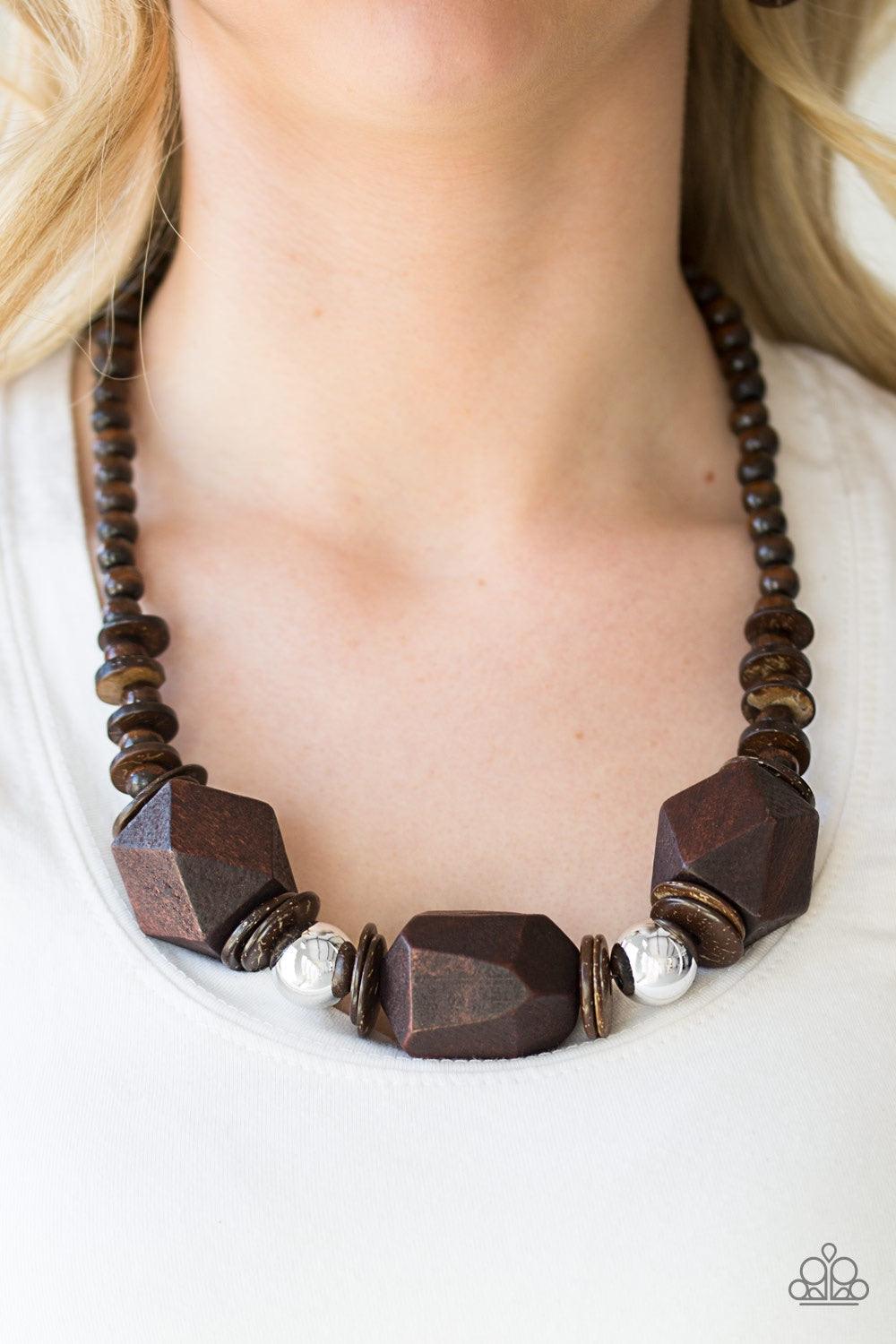 Paparazzi Accessories Costa Maya Majesty - Brown Featuring abstract geometric finishes, mismatched brown wooden beads are threaded along shiny brown cording. Dramatic silver beads are sprinkled between the earthy beading, creating a bold seasonal look bel