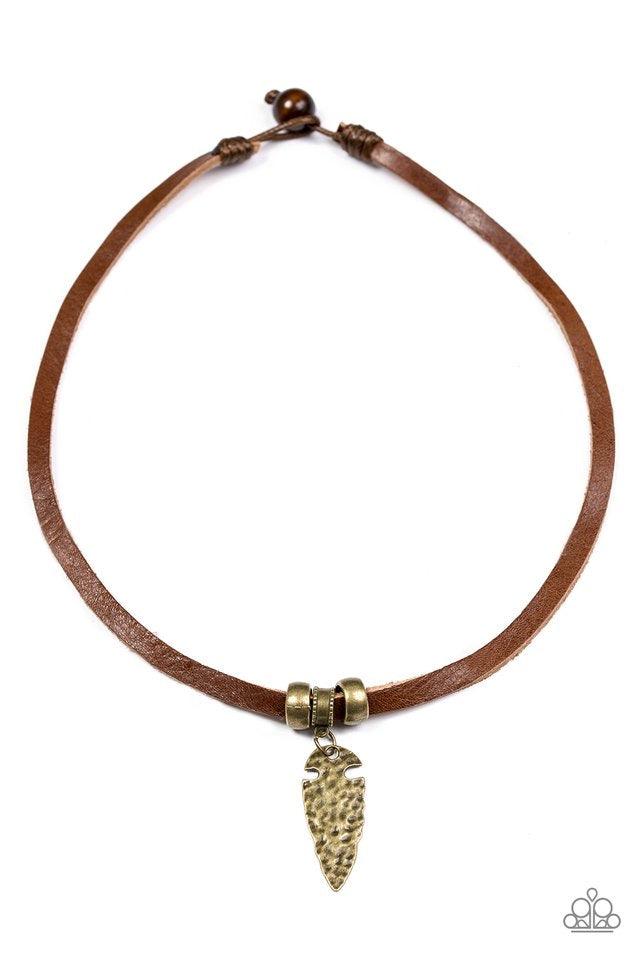 Paparazzi Accessories Every CAVEMAN For Himself - Brass Etched in tribal inspired textures, brass accents slide along a strand of brown leather for an urban look. Hammered in an antiqued shimmer, a brass arrowhead pendant swings from the center for an ind