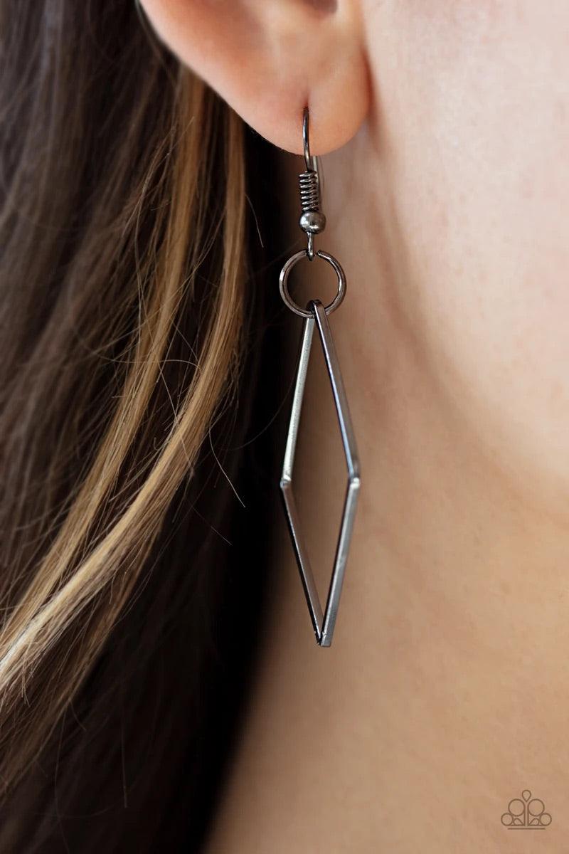 Paparazzi Accessories Fashion Fave - Black A collection of interlocking diamond-shaped frames give way to rows of mismatched gunmetal chains, creating edgy layers across the chest. Features an adjustable clasp closure. Sold as one individual necklace. Inc