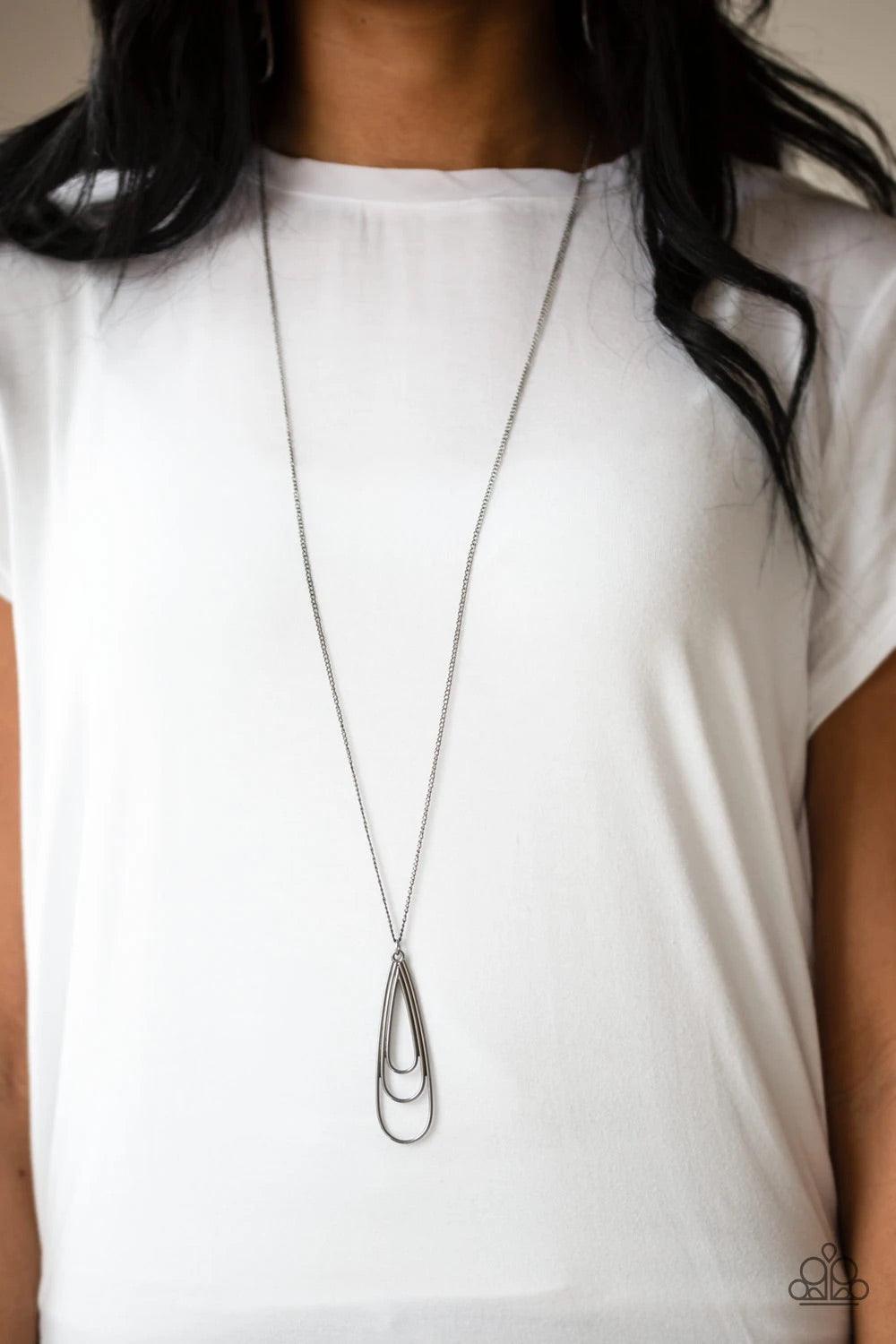 Paparazzi Accessories The Big Three - Black Gradually increasing in size, glistening gunmetal teardrops coalesce into a rippling frame for an edgy look. The airy pendant swings from the bottom of a lengthened gunmetal chain for an edgy look. Features an a