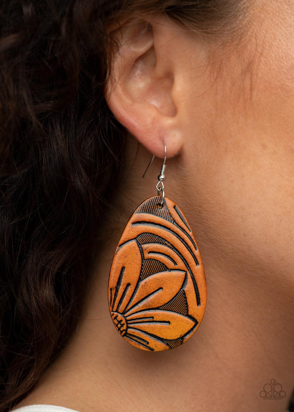 Paparazzi Accessories Garden Therapy - Brown Stamped and embossed in rustic floral detail, a brown leather teardrop frame swings from the ear for a whimsically seasonal look. Earring attaches to a standard fishhook fitting. Sold as one pair of earrings. J