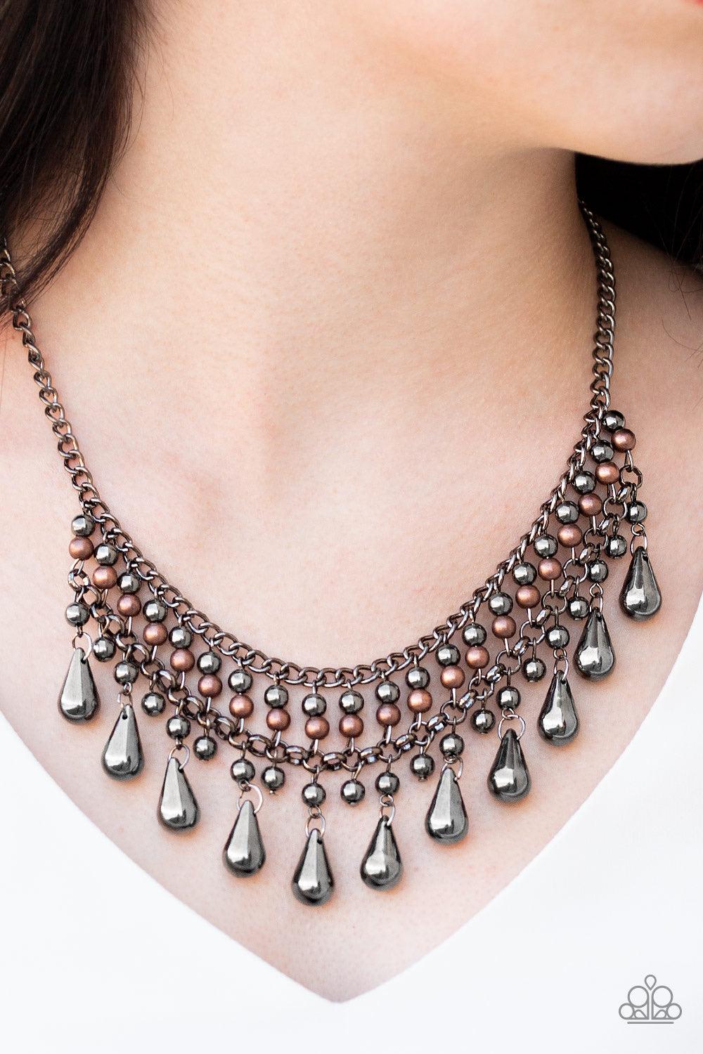 Paparazzi Accessories Don’t Forget to BOSS! - Black Threaded along metallic rods, stacked gunmetal and copper beads give way to shimmery gunmetal teardrops. The edgy fringe flawlessly drapes beneath the collar, creating a sassy tapered fringe. Features an