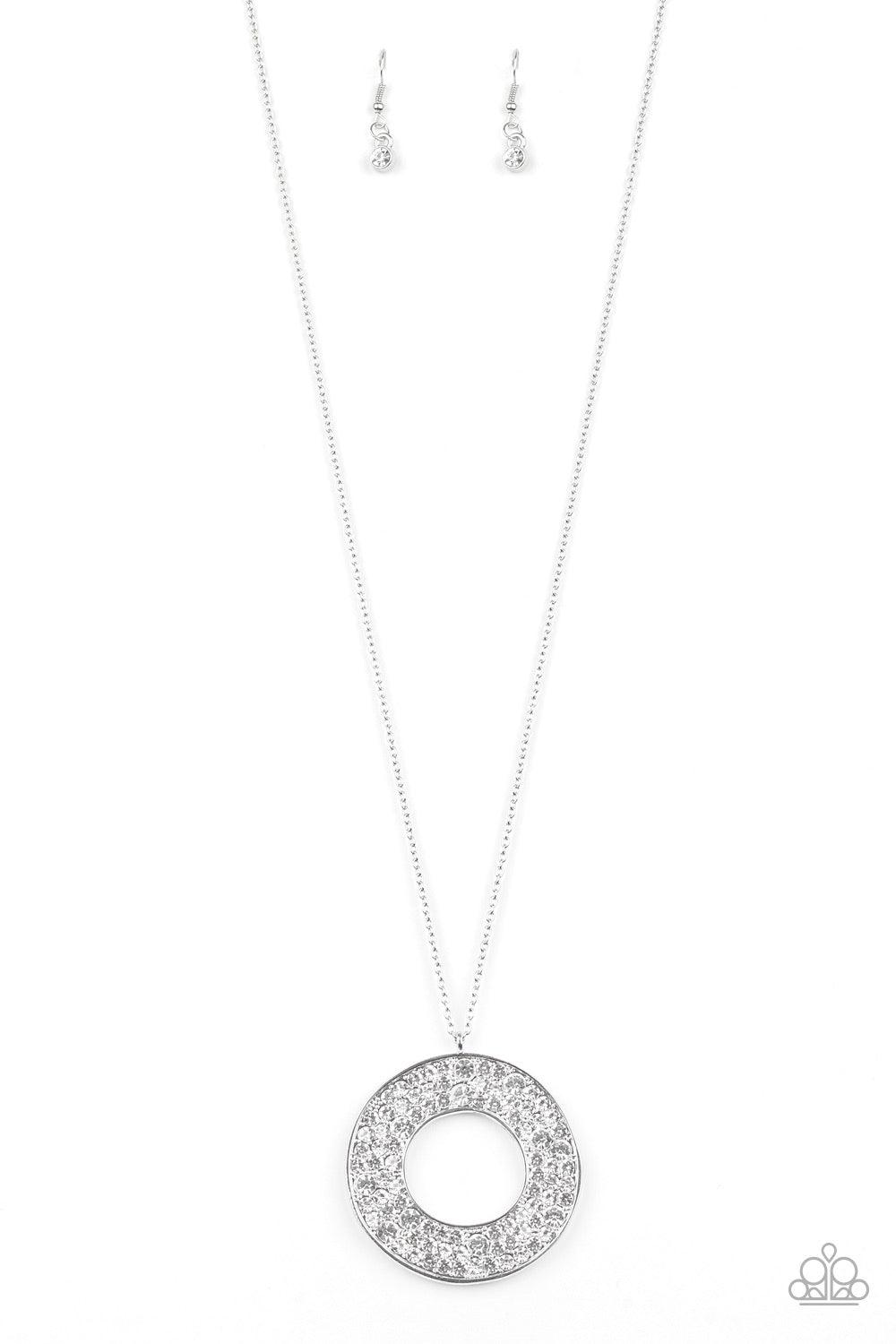 Paparazzi Accessories Bad HEIR Day - White Encrusted in row after row of glittery white rhinestones, an oversized round pendant swings from the bottom of a lengthened silver chain for a blinding look. Features an adjustable clasp closure. Jewelry