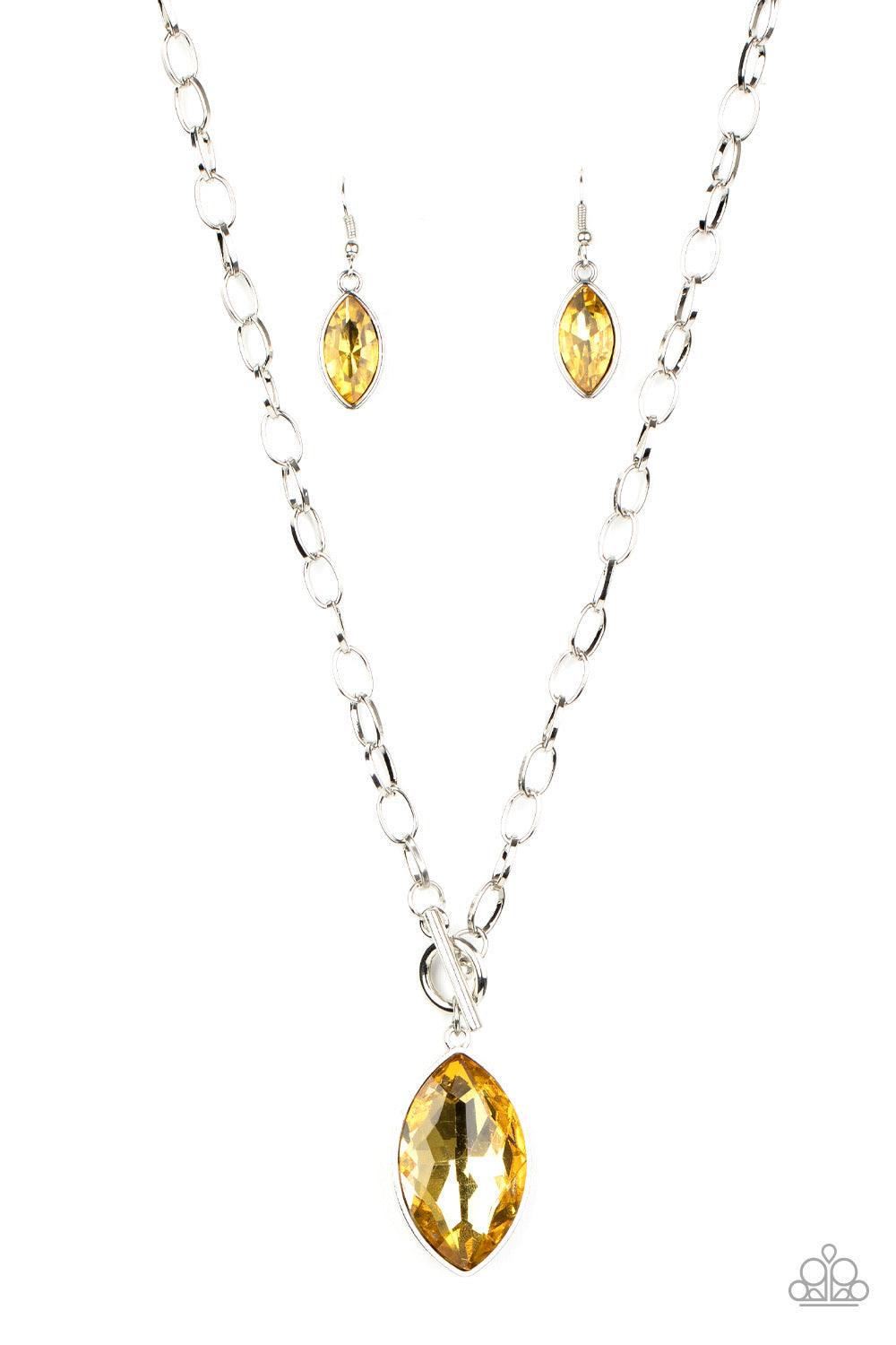 Paparazzi Accessories Unlimited Sparkle - Yellow Featuring a regal marquise style cut, a dramatically oversized golden yellow rhinestone swings from a chunky silver chain, creating a gorgeous pendant below the collar. Features a toggle closure. Sold as on