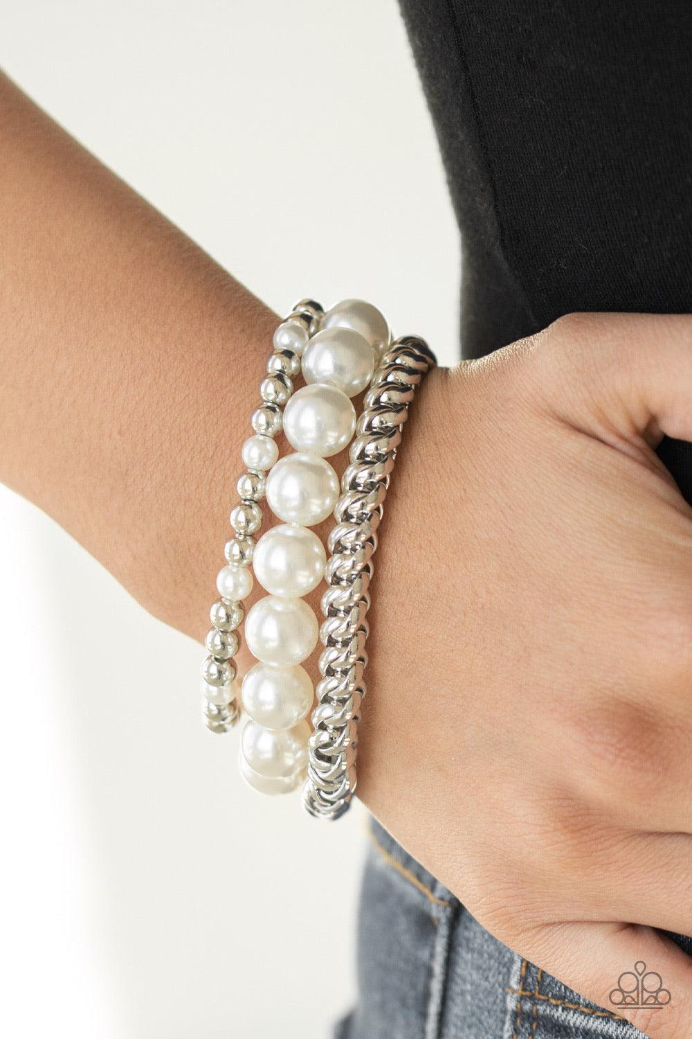 Paparazzi Accessories A PEARL-fect Ten - White A refined collection of dainty silver beads, oversized pearls, and exaggerated silver chain are threaded along stretchy bands around the wrist for a vintage inspired look. Jewelry