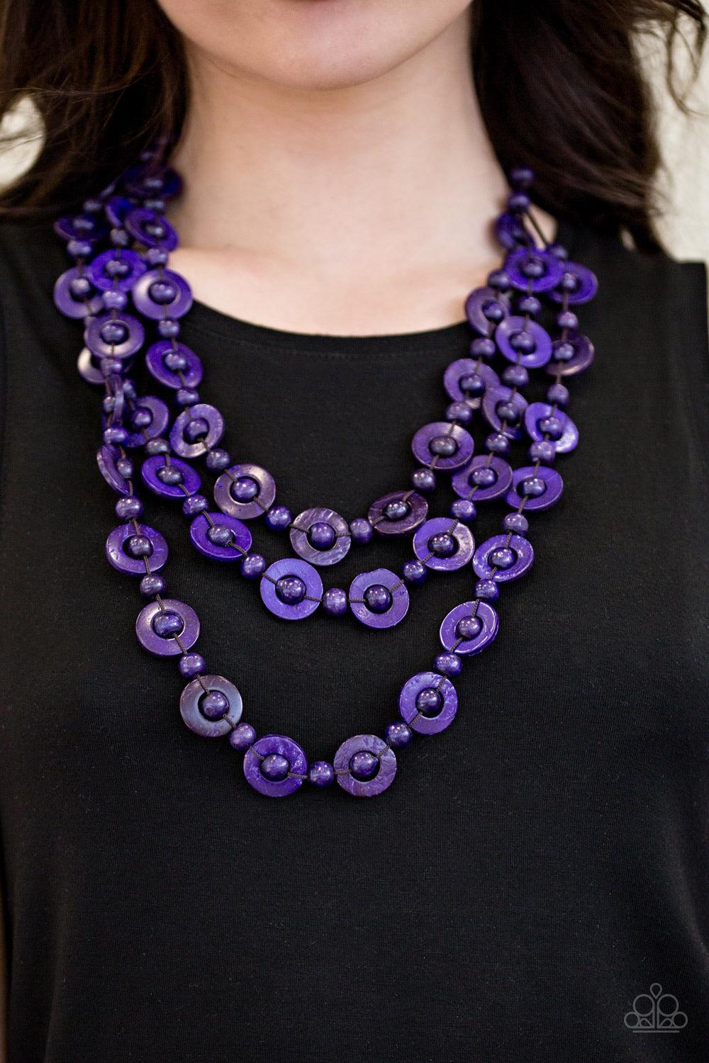 Paparazzi Accessories Bermuda Belle - Purple Brushed in a vivacious purple finish, wooden rings and beads are knotted in place along three strands, creating summery layers down the chest. Features a button loop closure. Jewelry