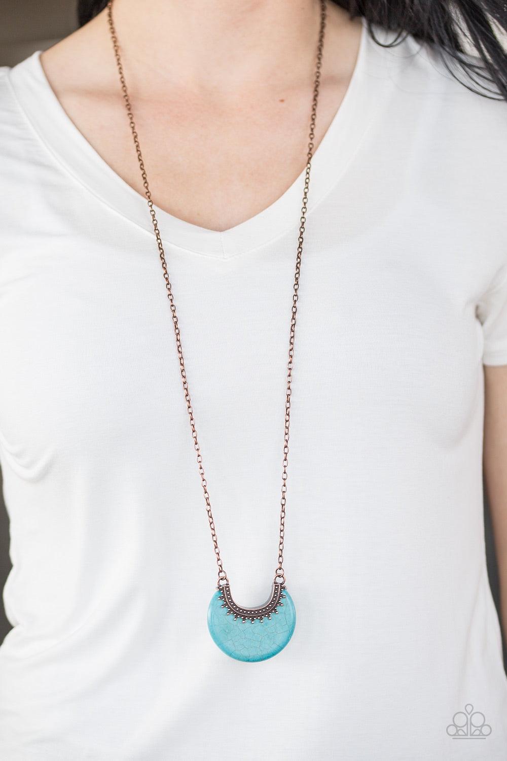 Paparazzi Accessories Mesa Moon - Cooper Chiseled into an earthy crescent, a refreshing turquoise stone attaches to a studded copper frame, creating a bold artisanal pendant. Features an adjustable clasp closure. Jewelry