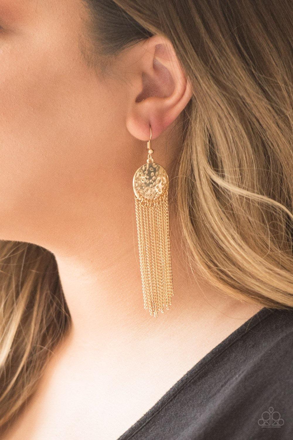 Paparazzi Accessories Solar Scene - Gold Shimmering gold chains stream from the bottom of a delicately hammered gold frame, creating a casual fringe. Earring attaches to a standard fishhook fitting. Sold as one pair of earrings. Jewelry