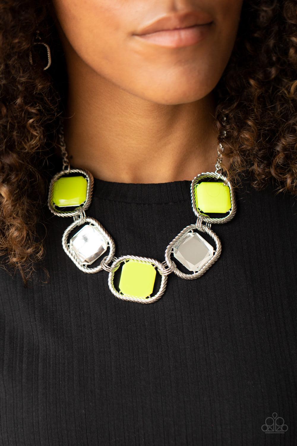Paparazzi Accessories Pucker Up - Yellow Featuring regal cuts, faceted white gems and Green Sheen beads are pressed into the centers of rope-like silver frames that triple link below the collar for a dramatic pop of color. Features an adjustable clasp clo
