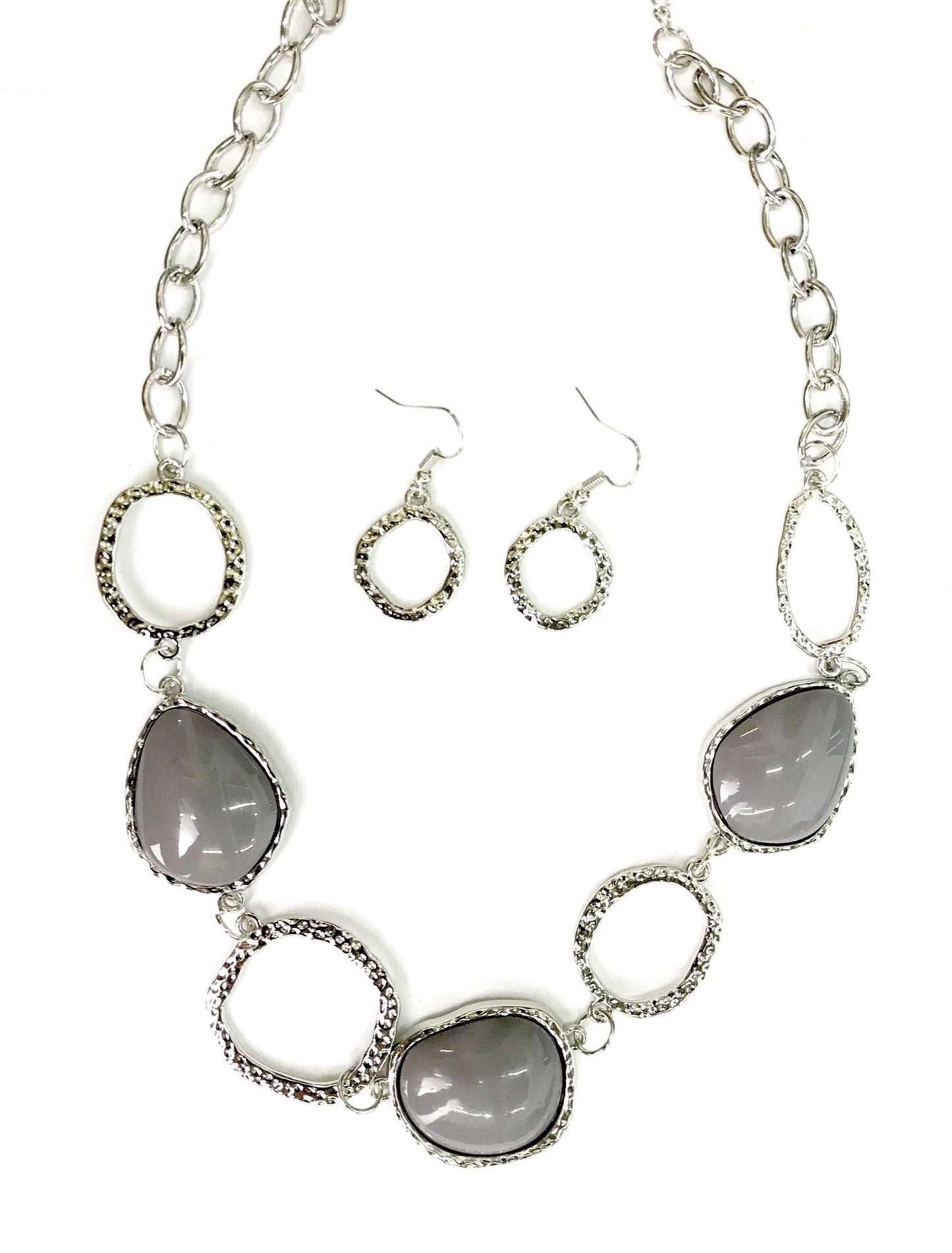 Paparazzi Accessories Haute Heirloom - Silver Delicately hammered in shimmery textures, asymmetrical silver rings and silver beaded frames link below the collar for a colorful look. Features an adjustable clasp closure. Jewelry
