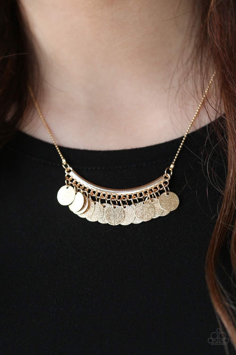 Paparazzi Accessories Bohemian Bombshell - Gold Delicately hammered in glistening textures, glittery gold discs swing from the bottom of a bowing gold bar for a flirty, bohemian look. Features an adjustable clasp closure. Jewelry