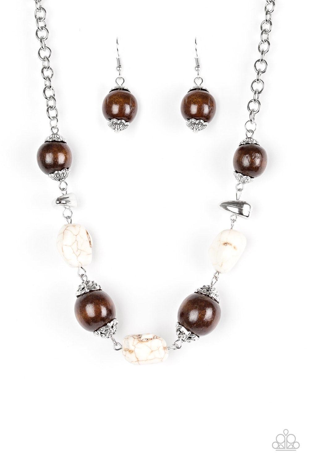 Paparazzi Accessories Earth Goddess - White Infused with ornate silver accents, refreshing white stones and round wooden beads trickle along a shimmering silver chain, creating an artisanal statement piece that falls just below the collar. Features an adj