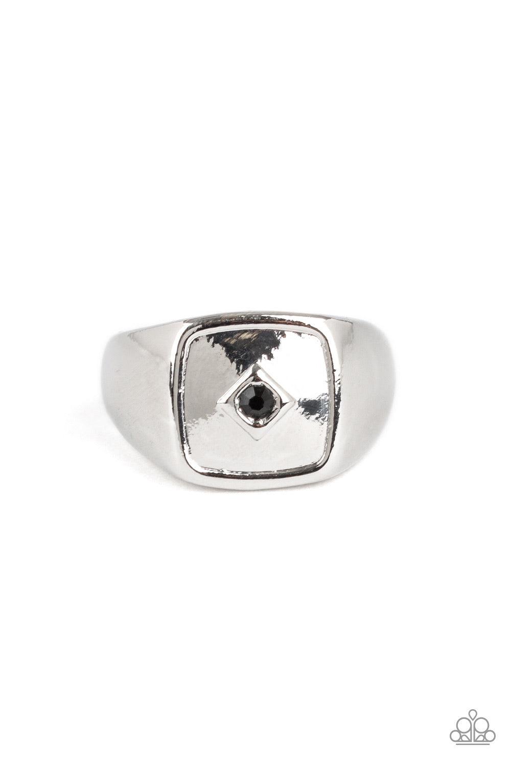 Paparazzi Accessories Immortal - Black A solitaire black rhinestone is pressed into the center of a flattened square frame for a statement look. Features a stretchy band for a flexible fit. Sold as one individual ring. Jewelry