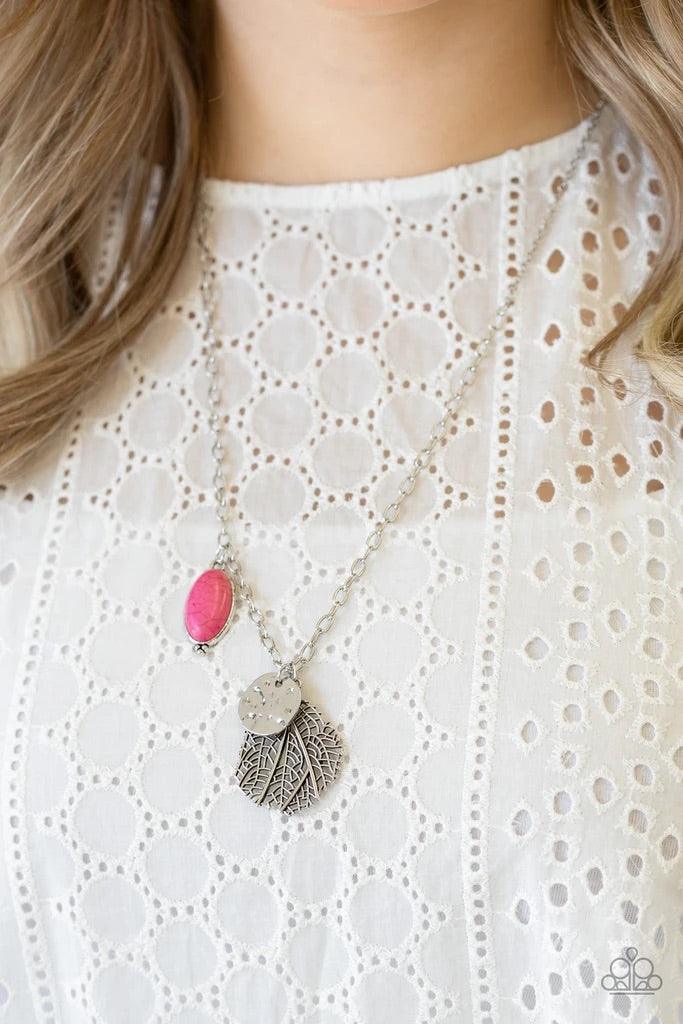Paparazzi Accessories Free-Spirited Forager - Pink An oval pink stone, hammered silver disc, and lifelike silver leaf charm swing from the bottom of a lengthened silver chain, creating a whimsical pendant. Features an adjustable clasp closure. Sold as one