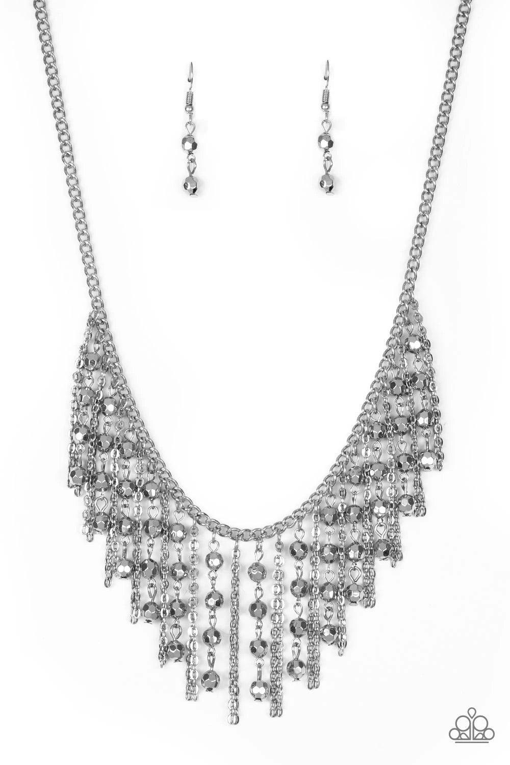 Paparazzi Accessories Rebel Remix - Silver Stands of faceted silver beads and glistening silver chains stream from a matching silver chain, creating an edgy fringe below the collar. Features an adjustable clasp closure. Sold as one individual necklace. In