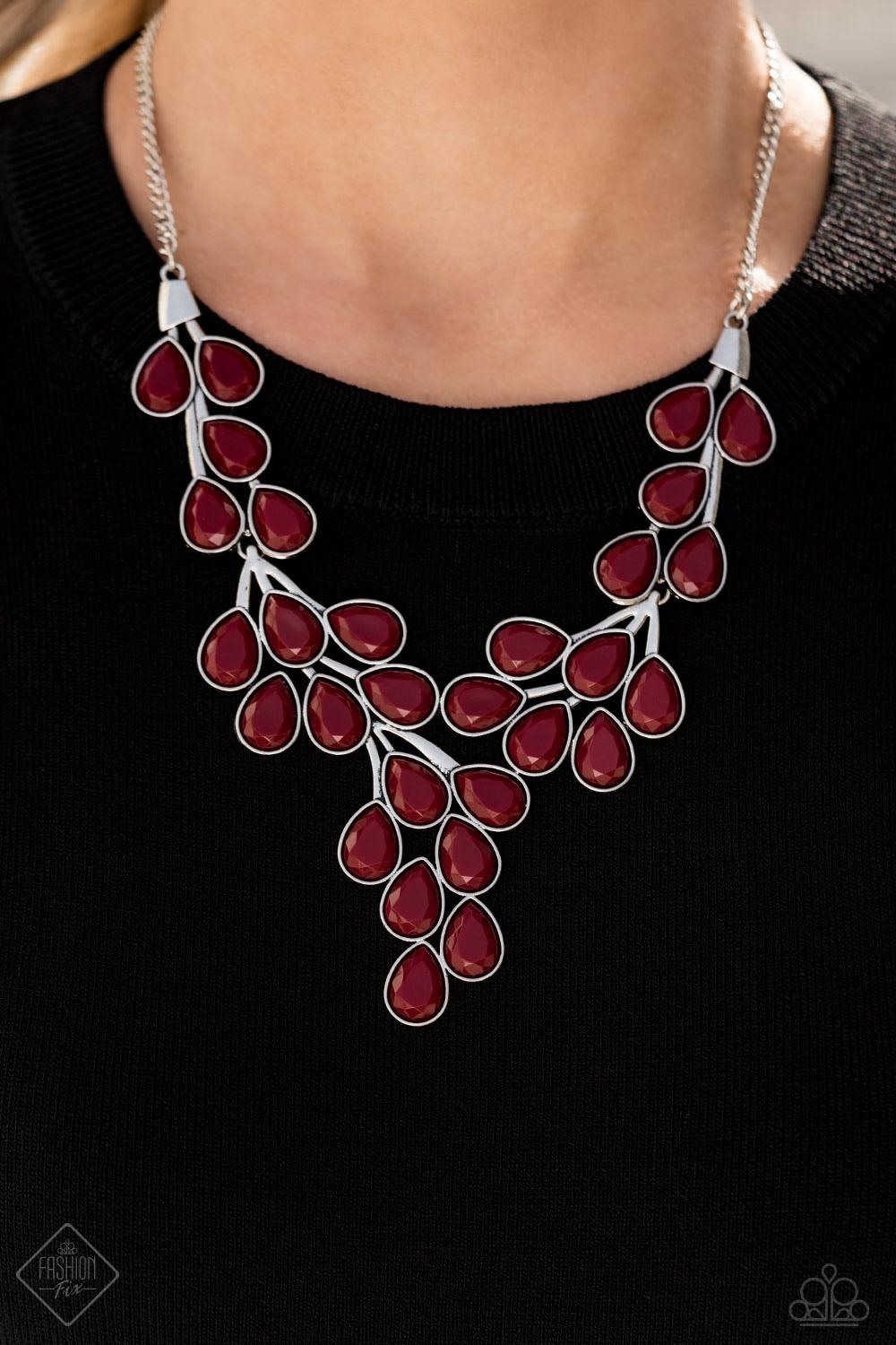 Paparazzi Accessories Eden Deity - Red Teardrop shaped beads in the deep, rich shade of Wine are encased in sleek silver frames and clustered together in vine-like patterns. The faceted edges of the beads catch the light as they branch out below the colla