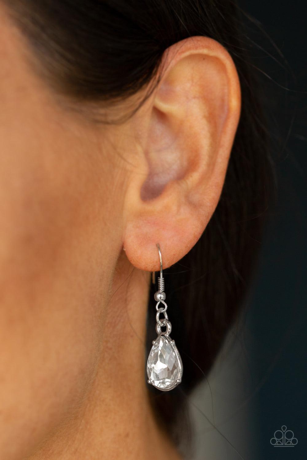 Paparazzi Accessories Debutante Drama - White A collection of round and teardrop white rhinestones coalesce into dazzling frames as they link below the collar, creating a glamorous fringe. Features an adjustable clasp closure. Jewelry