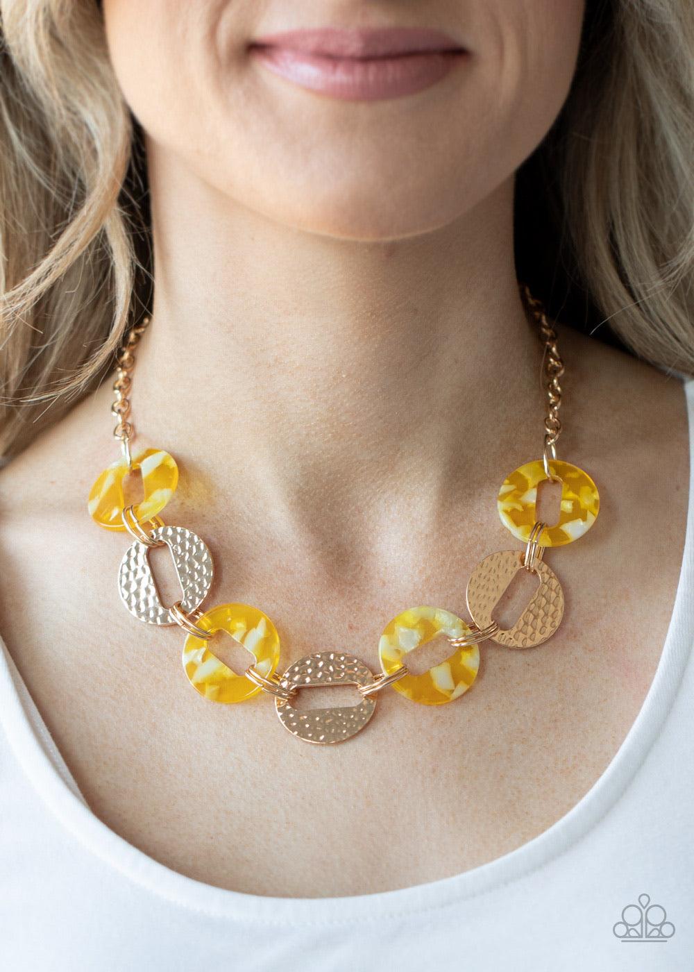 Paparazzi Accessories Retro Retrograde - Yellow Featuring airy circular shapes, hammered gold frames link with shiny yellow acrylic frames below the collar for a colorfully retro look. Features an adjustable clasp closure. Sold as one individual necklace.