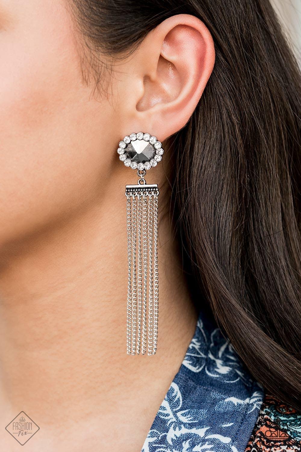 Paparazzi Accessories Tassel Throwback - Silver Silver chains stream from the bottom of a faceted silver bead that has been nestled inside a ring of glittery white rhinestones, creating a flirtatious tassel. Earring attaches to a standard post fitting. Je