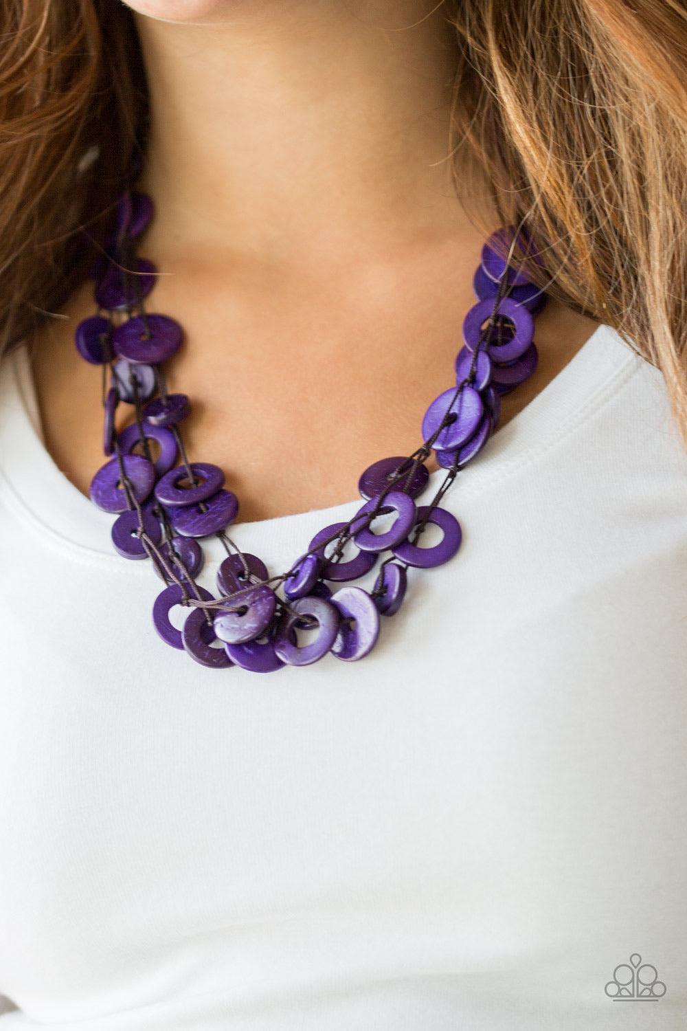 Paparazzi Accessories Wonderfully Walla Walla ~Purple Shiny brown cording knots around mismatched purple wooden beads, creating vivacious layers. Features a button loop closure.