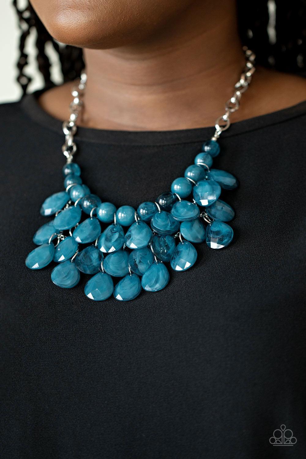 Paparazzi Accessories Sorry Burst Your Bubble - Blue Attached to a bold silver chain, round opaque Mosaic Blue beads are threaded along an invisible wire below the collar. Attached to a net of silver chains, faceted opaque teardrops cascade from the botto