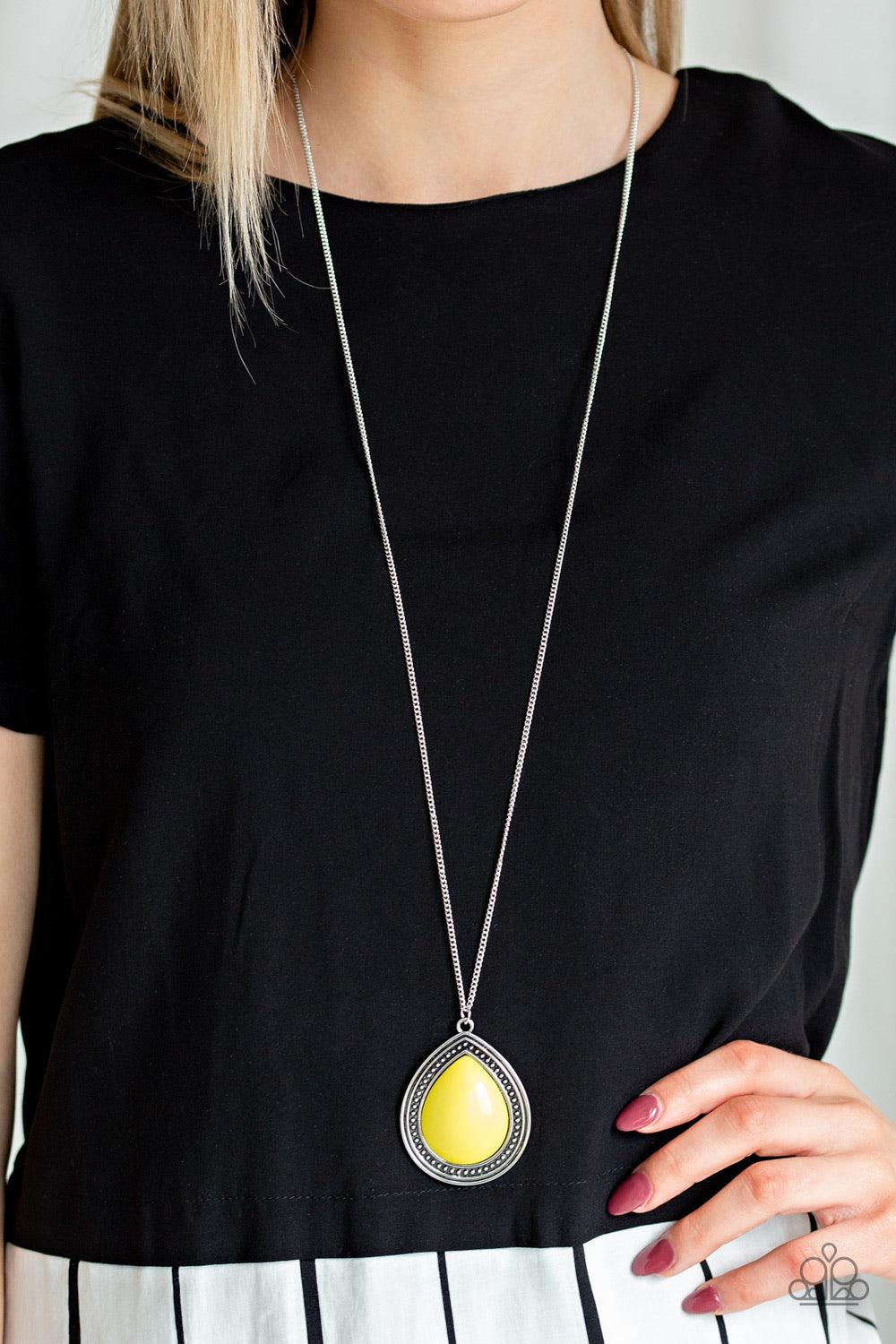 Paparazzi Accessories Chroma Courageous - Yellow An oversized yellow bead is pressed into the center of a studded teardrop frame, creating a vibrant pop of color at the bottom of a lengthened silver chain. Features an adjustable clasp closure. Sold as one