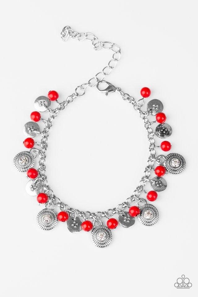 Paparazzi Accessories Pure LUXE - Red Dainty red beads and ornate silver discs swing from a shimmery silver chain, creating a casual fringe around the wrist. Featuring rhinestone centers, textured silver discs are sprinkled between refined beading for a g