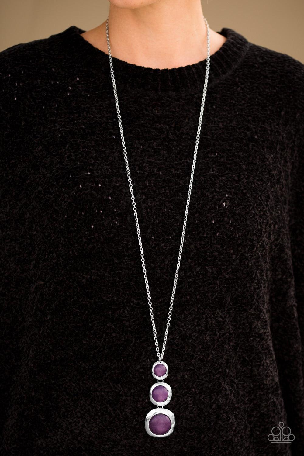 Paparazzi Accessories Stone Tranquility - Purple Smooth purple stones are pressed into the centers of asymmetrical silver frames. Gradually increasing in size, the earthy stones connect into a dramatically stacked pendant. Features an adjustable clasp clo