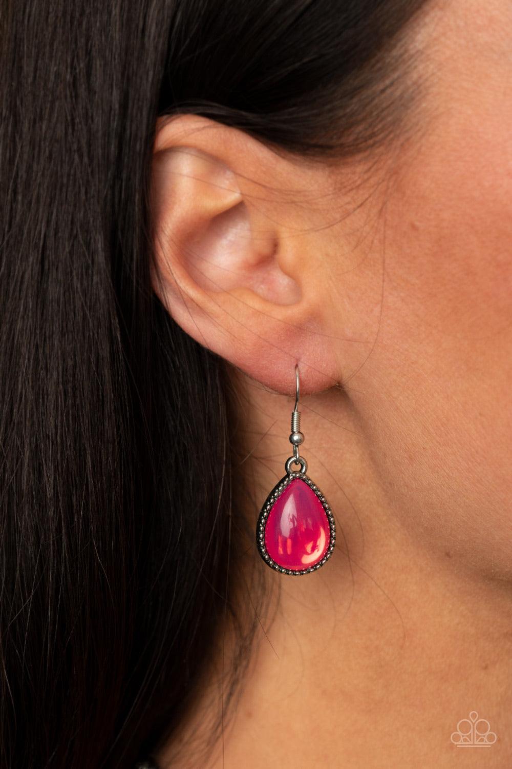 Paparazzi Accessories Opal Auras - Pink Featuring an opalescent shimmer, glassy pink teardrop beads are nestled inside shiny silver frames filled with vine-like antiqued filigree. Graduating in size, the whimsical frames delicately link below the collar f