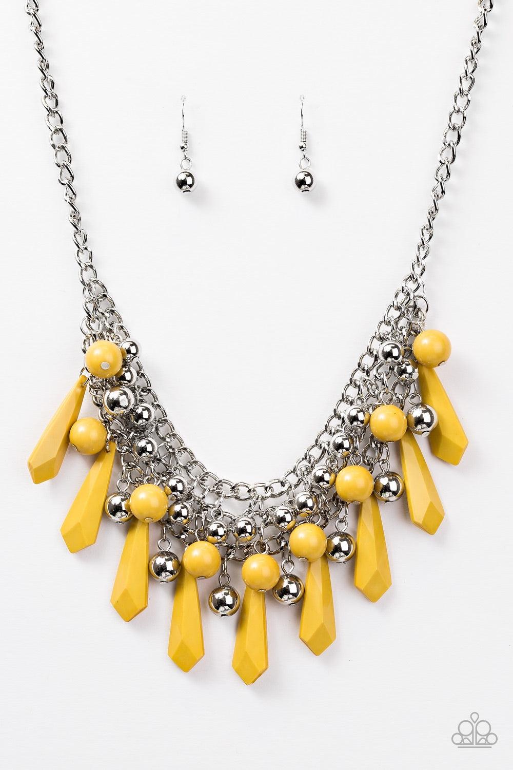 Paparazzi Accessories Diva Dynamics - Yellow Rows of shimmery silver chain interlock below the collar. Tinted in a hearty hue, polished and faceted yellow beads cascade from the interlocked chain, creating a bold fringe. Shiny silver beads are sprinkled b