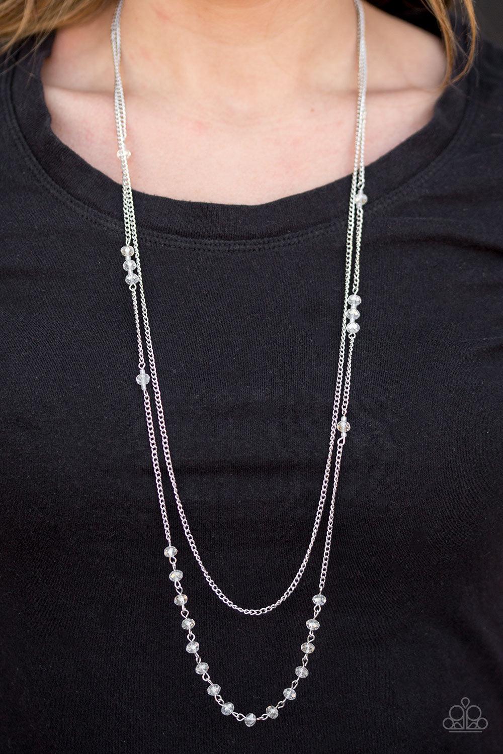 Paparazzi Accessories Rich With Glitz - White Brushed in an iridescent finish, white crystal-like beads trickle along a shimmery silver chain. A plain silver chain hangs above the glittery beads for a refined layered finish. Features an adjustable clasp c