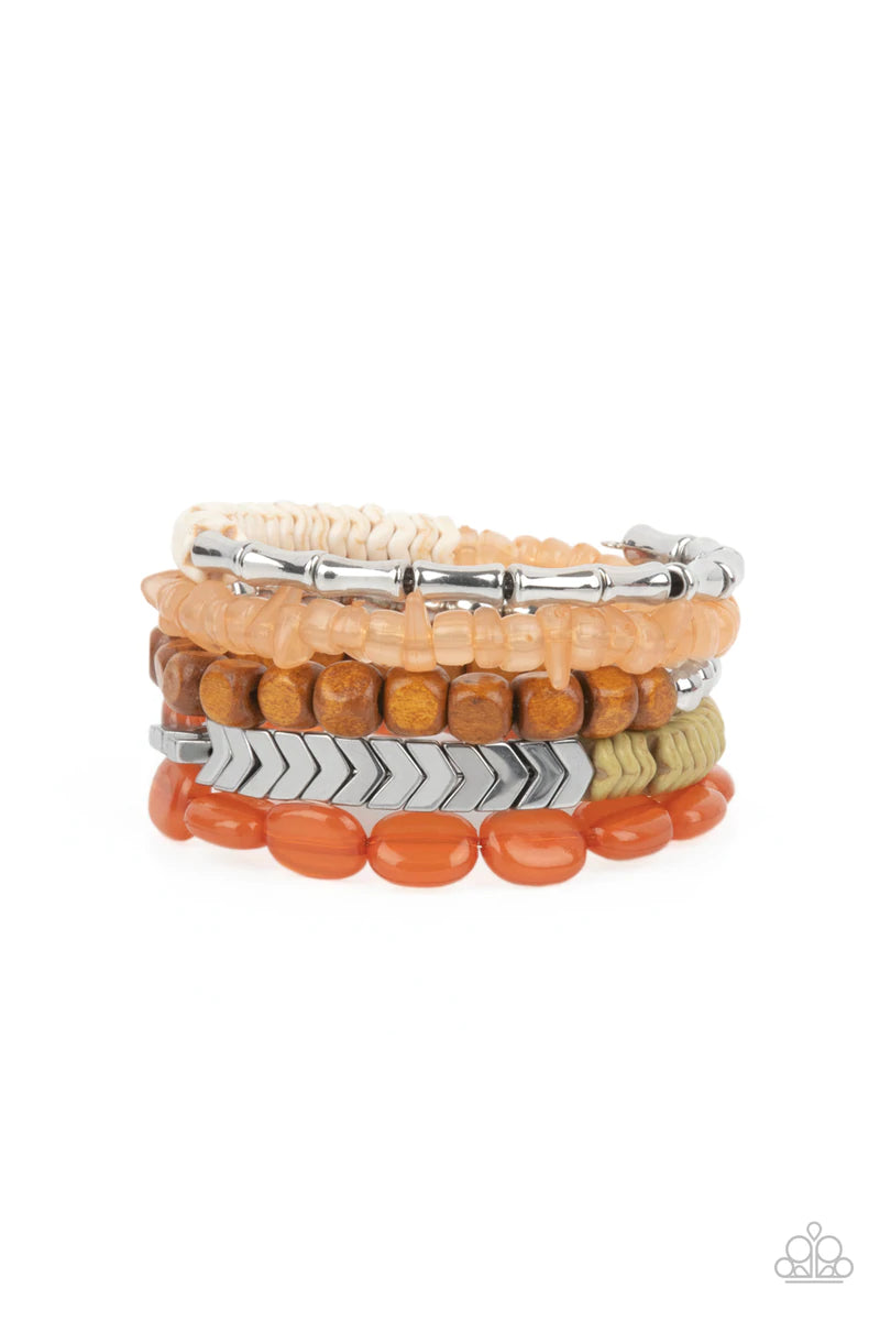 Paparazzi Accessories Outdoor Retreat - Multi An earthy collection of wooden cubes, glassy orange acrylic ovals, wavy orange accents, tranquil orange pebble-like accents, classic silver beads and silver chevron frames are threaded along a long wire to cre