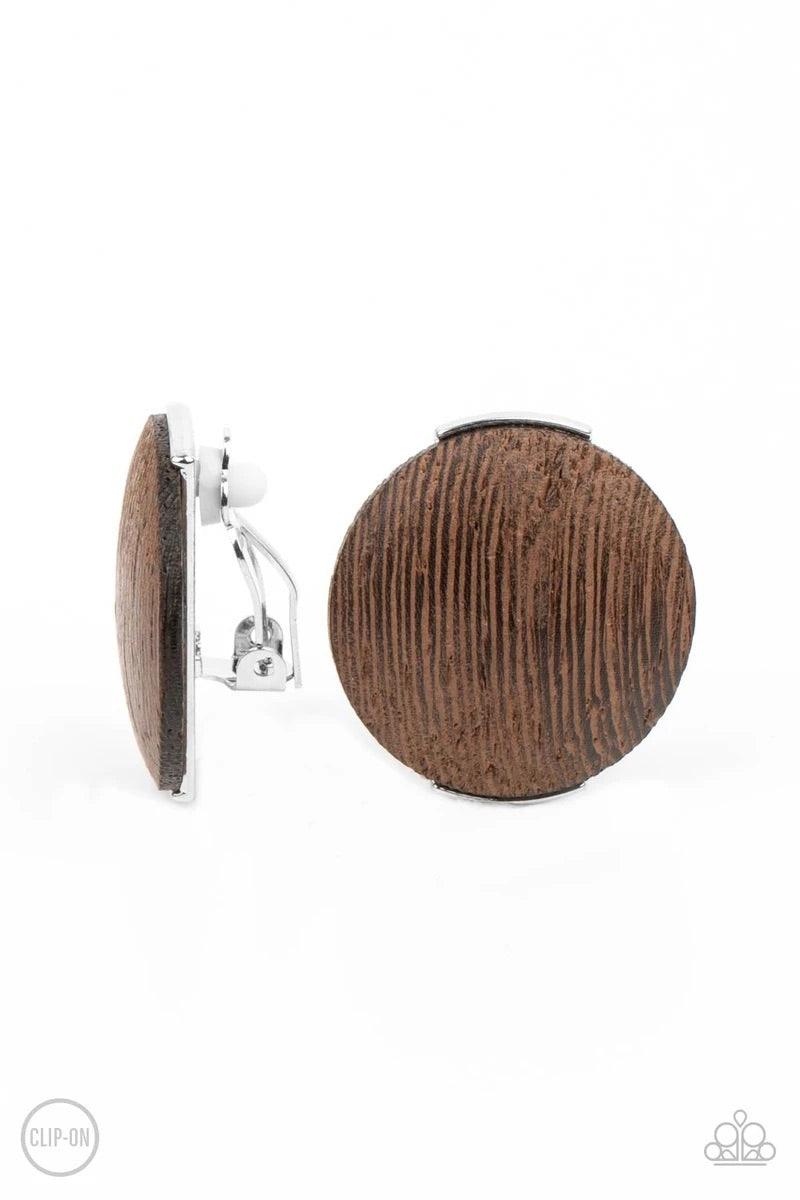 Paparazzi Accessories WOODWORK It ~Brown *Clip-On An oversized brown wooden disc is fitted in place between a silver frame, creating an earthy effect. Earring attaches to a standard clip-on fitting. Sold as one pair of clip-on earrings. Jewelry