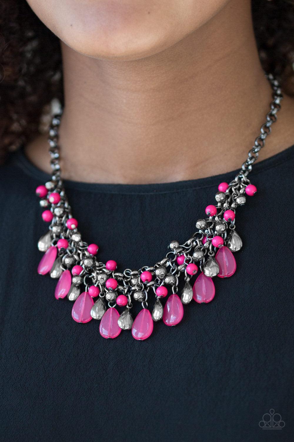 Paparazzi Accessories Diva Attitude - Pink Glistening gunmetal and vivacious pink teardrops drip from the bottom of interlocking gunmetal chains. Matching gunmetal and pink beads trickle down the rows of chain, creating a bold fringe below the collar. Fea