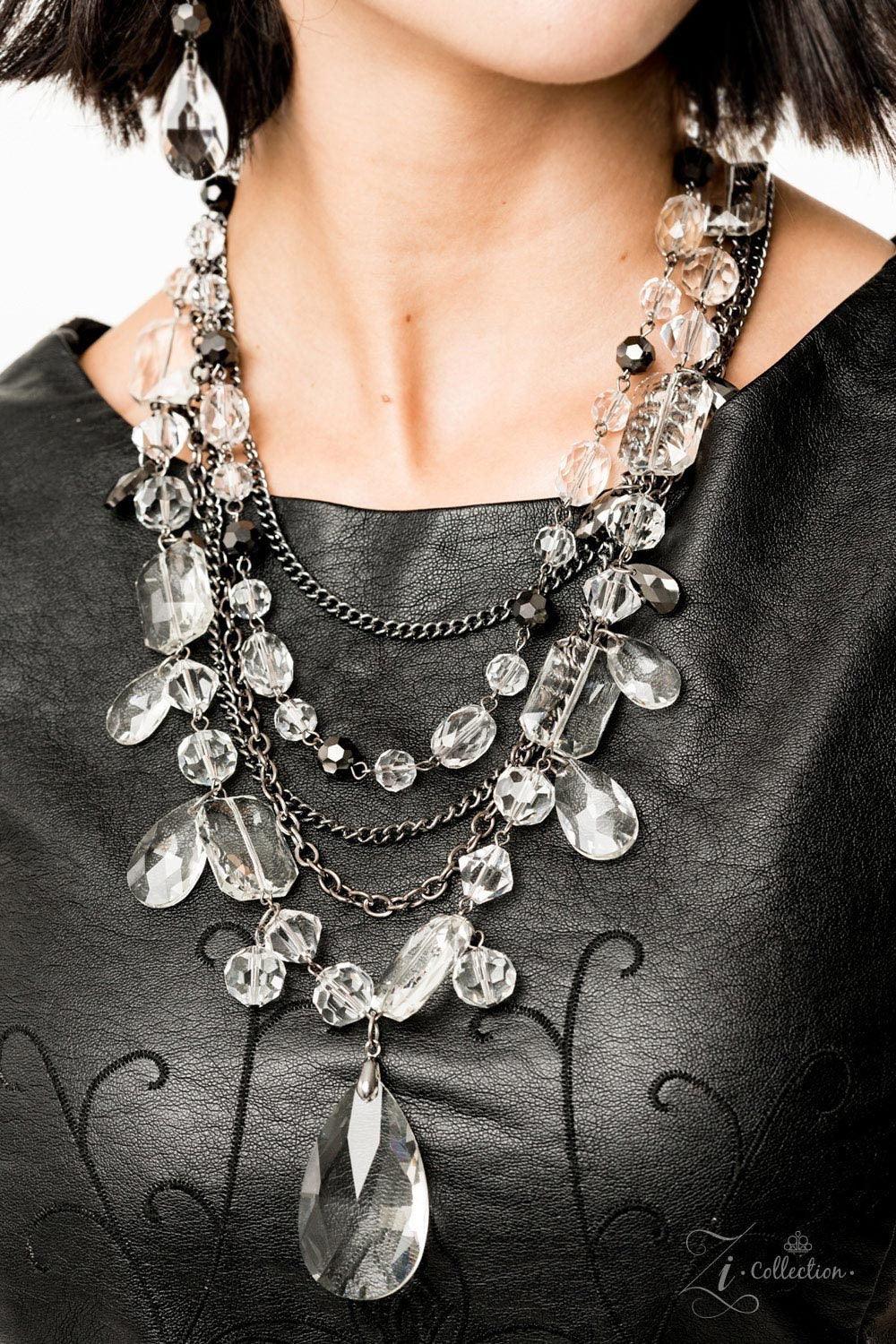 Paparazzi Accessories Prismatic 💗ZiCollection $25💗 Three stands of glistening gunmetal chains collide with a blinding rows of mismatched shimmer below the collar. Featuring round, marquise, emerald, and teardrop cuts an glamorous rows of glassy white an