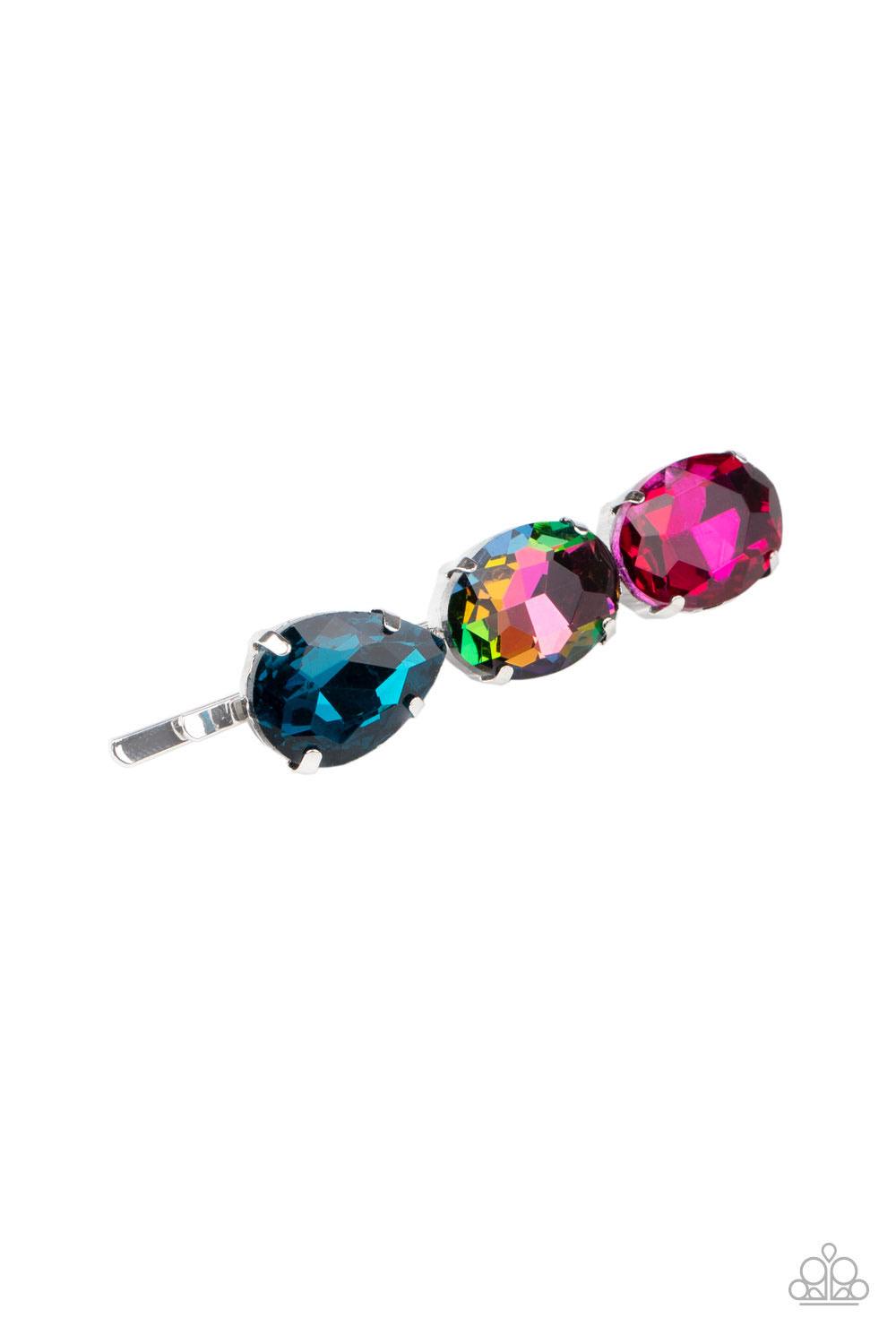 Paparazzi Accessories Beyond Bedazzled - Multi A teardrop blue gem, oval oil spill gem, and oval pink gem are encrusted across the front of a bobby pin for a bedazzling look. Sold as one individual decorative bobby pin. Hair Accessories