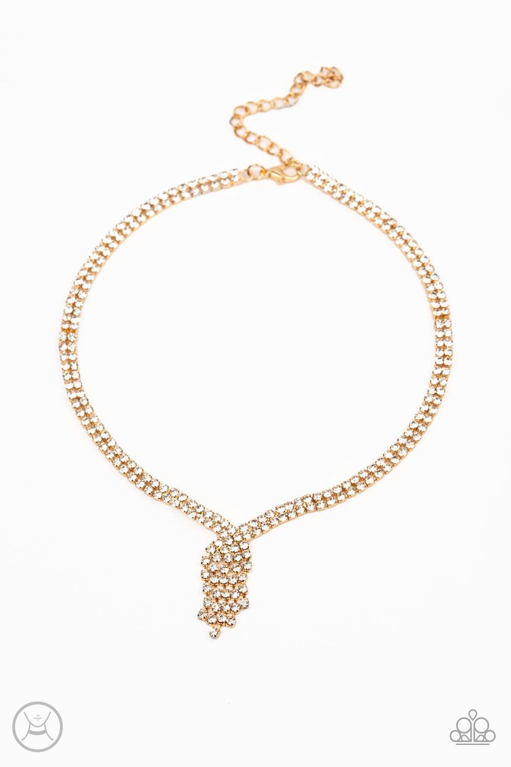 Paparazzi Accessories Ante Up - Gold Featuring sleek gold fittings, two strands of glittery white rhinestones join into a sparkling chain below the collar. Chains flow in from both sides at varying lengths creating a glamorously asymmetrical pendant. Feat