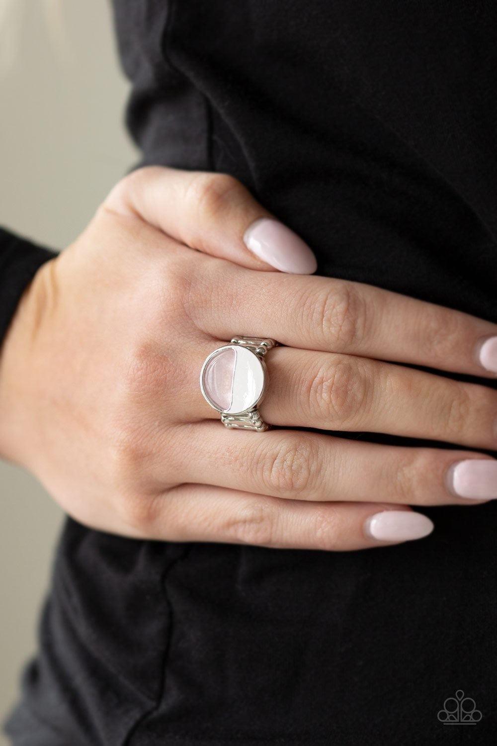 Paparazzi Accessories Stone Seeker - Pink Chiseled into a tranquil crescent shape, a glassy pink stone is pressed into the bottom half of a circular silver frame for an on-trend look. Features a stretchy band for a flexible fit. Jewelry