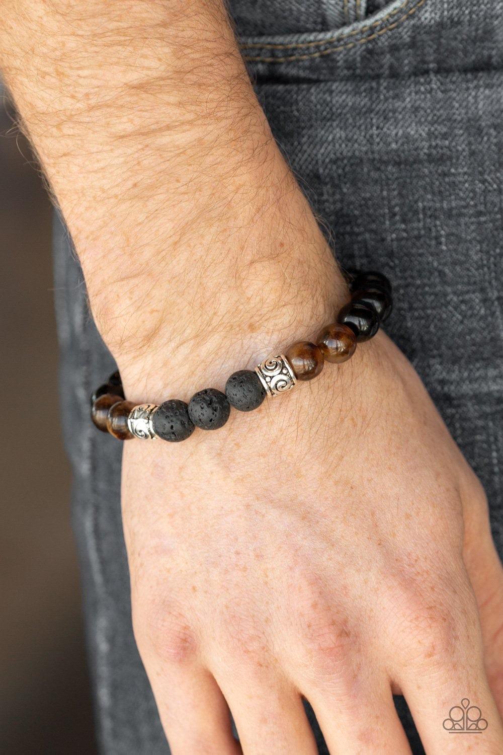 Paparazzi Accessories Mantra - Brown Infused with ornate silver beads, a collection of polished black beads, black lava rock beads, and brown stone beads are threaded along a stretchy band around the wrist for a seasonal look. Jewelry