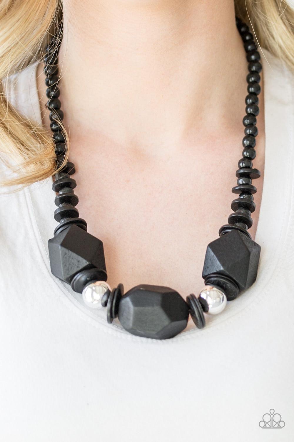 Paparazzi Accessories Costa Maya Majesty - Black Featuring abstract geometric finishes, mismatched black wooden beads are threaded along shiny black cording. Dramatic silver beads are sprinkled between the earthy beading, creating a bold seasonal look bel